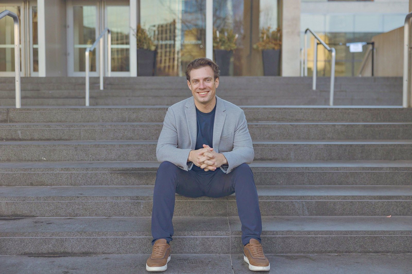 Bryan Cody on the front steps of a Grand Rapids home